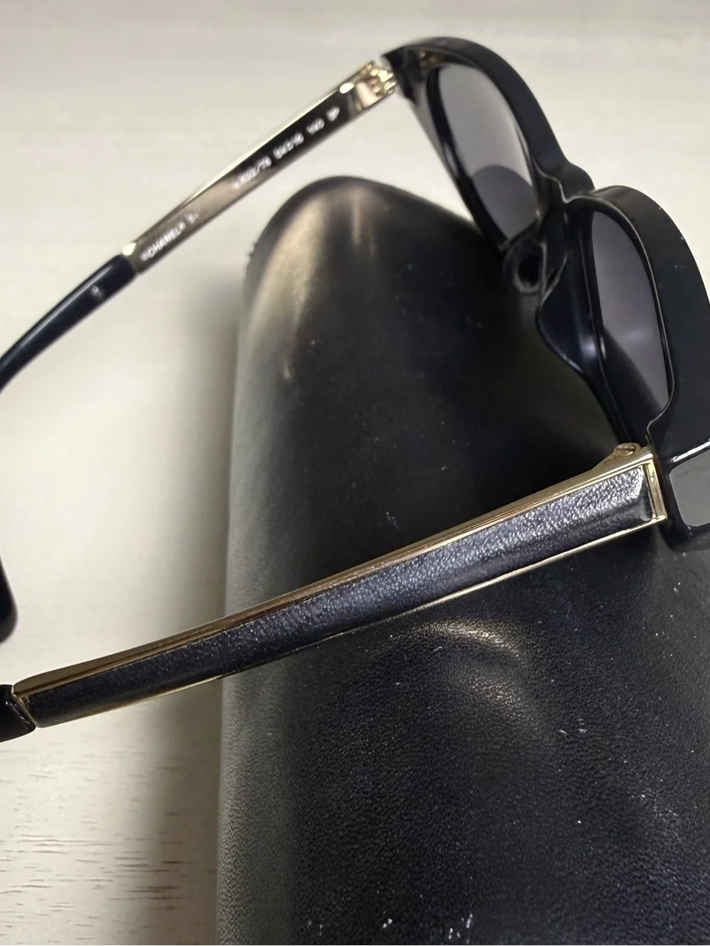 CHANEL Black Cat-Eye Sunglasses with Dark Lenses